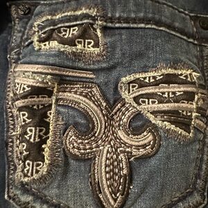 Rock Revival Distressed Blue Jeans with Black Accents